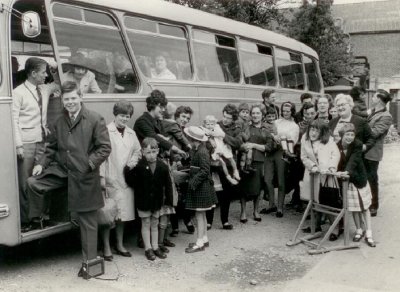 A group of children queueing for the bus