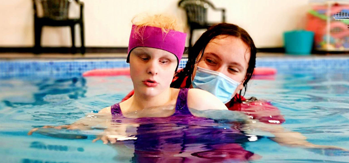 Image of a service user enjoying our pool