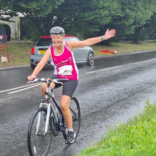 Wendy on her bike in the rain