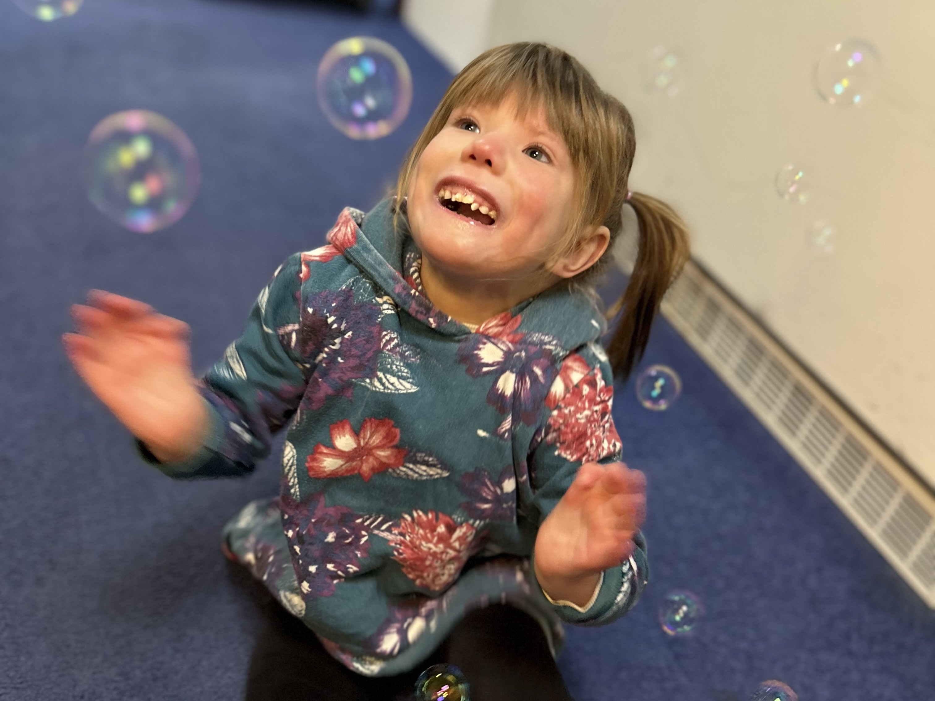Orla playing with bubbles