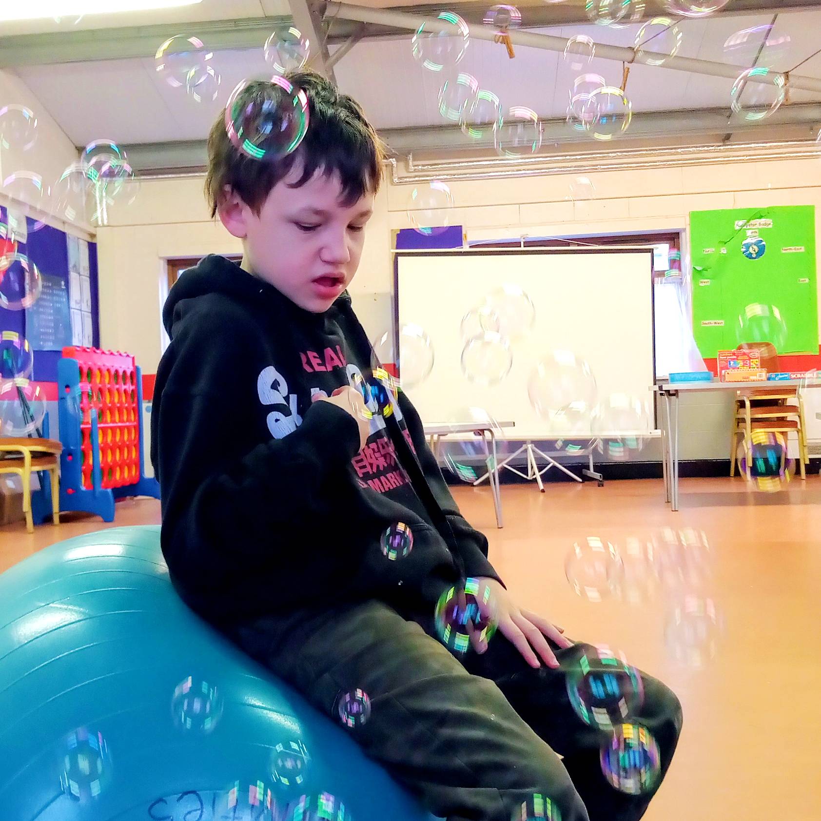 Charlie with bubbles in the holiday playscheme club