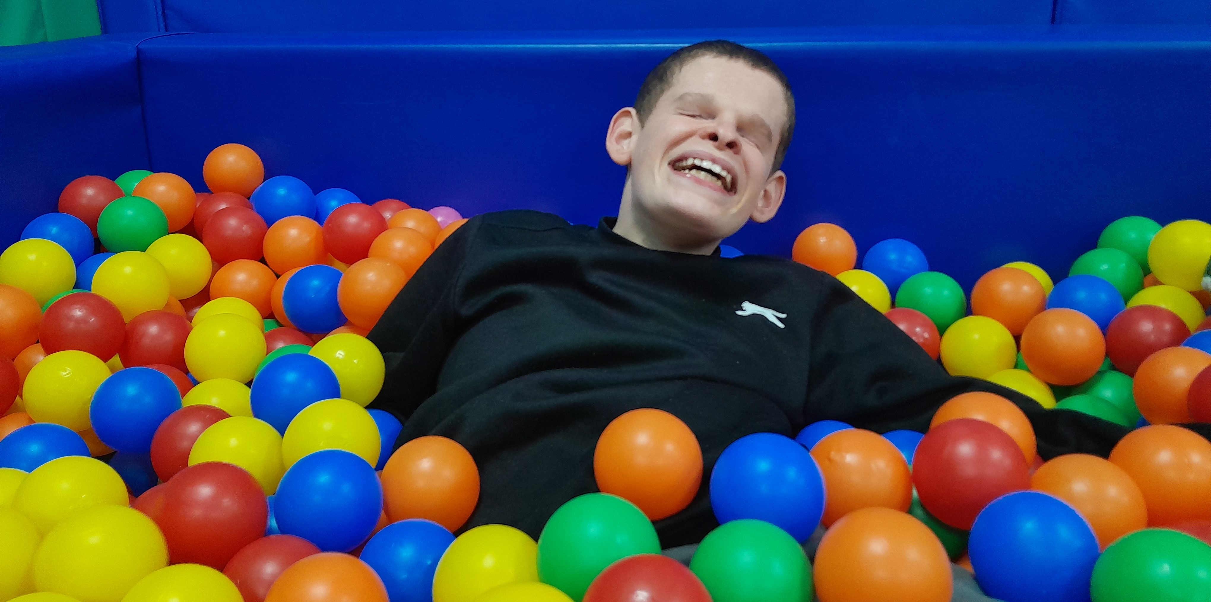 Liam in the ball pit