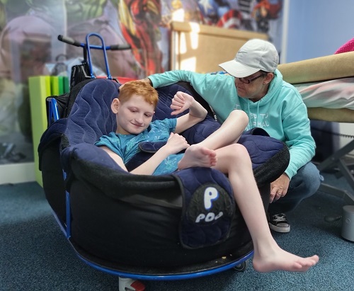 Young person in respite room with support worker