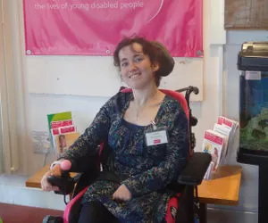 service user in wheelchair smiling